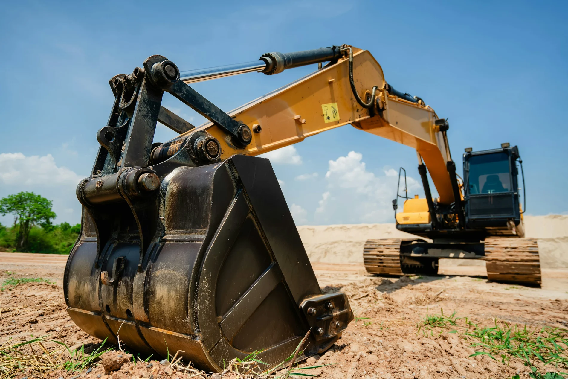 Excavator and digging bucket at an earthmoving site